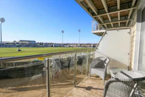 Two-bedroom flat overlooking Championship cricket ground goes up for sale – it’s so close you can almost touch the pitch
